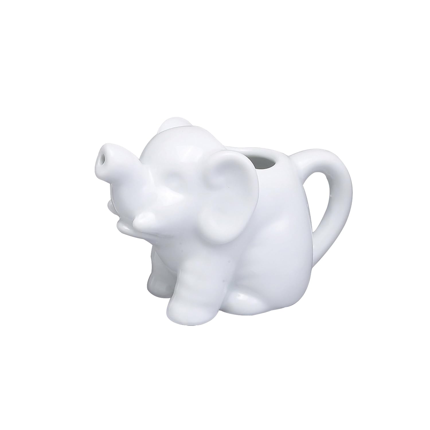 HIC Mini Elephant Creamer on a coffee table with cream pouring